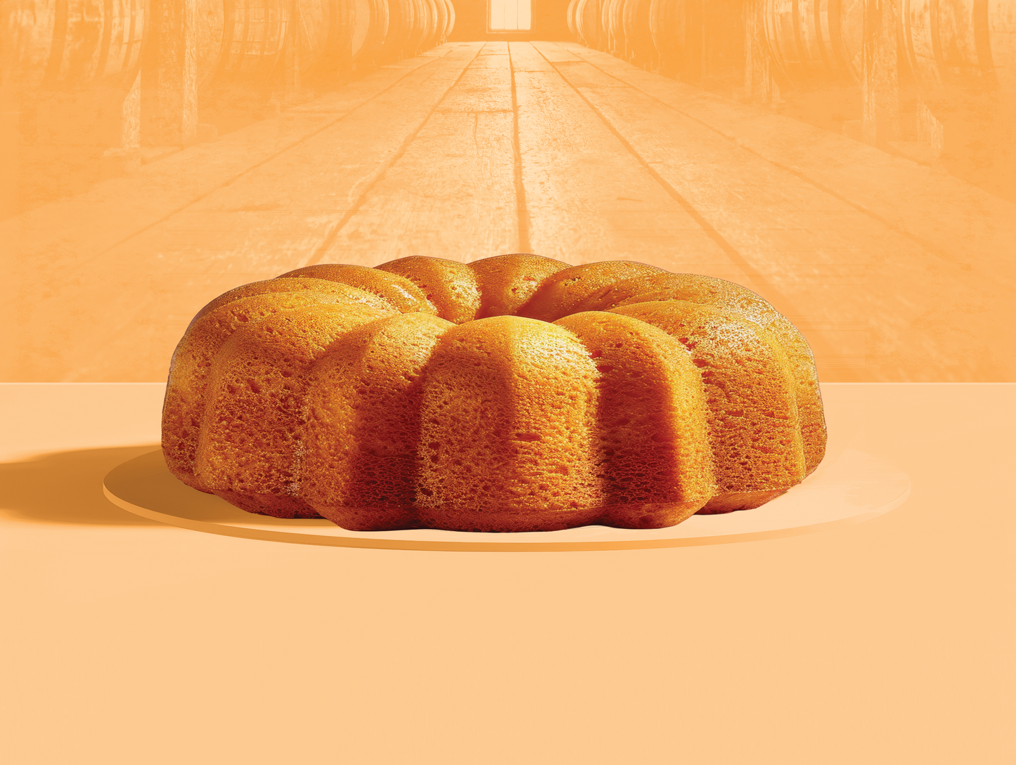 Bundt cake on a plate with an orange background
